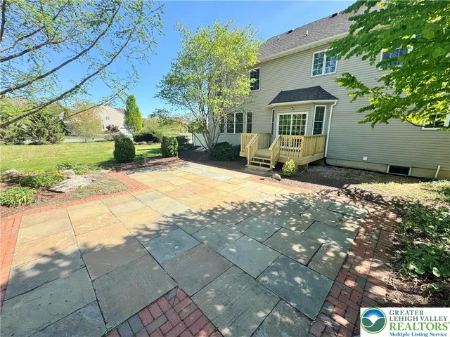 a view of house with yard