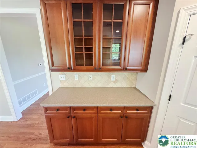 a view of front door with wooden floor