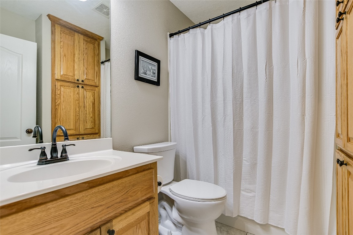 741 Knobbs Road McDade, TX 78650 - Photo 20 of 38 a bathroom with a sink a toilet and a mirror
