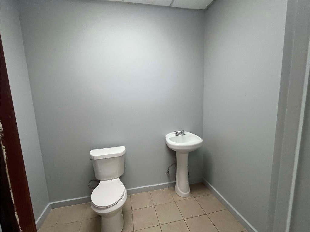 741 Knobbs Road McDade, TX 78650 - Photo 33 of 38 a bathroom with a toilet