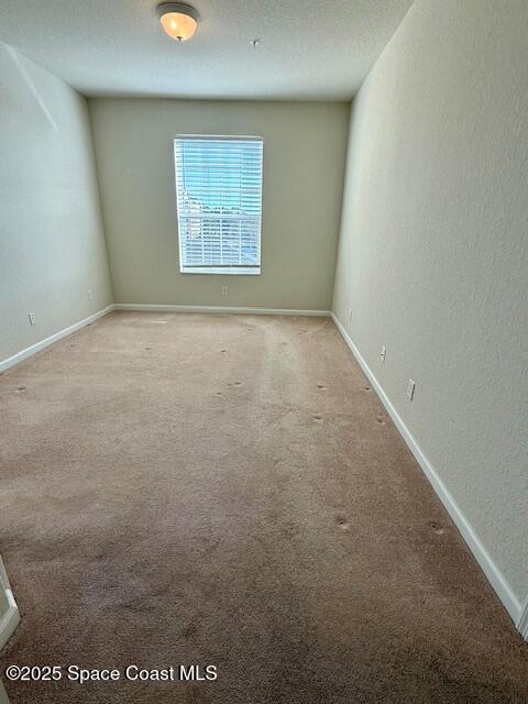 3868 Lexmark Lane, Unit 309 Rockledge, FL 32955 - Photo 13 of 39 an empty room with a empty space and windows