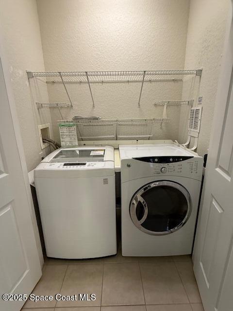 3868 Lexmark Lane, Unit 309 Rockledge, FL 32955 - Photo 18 of 39 a utility room with dryer and washer