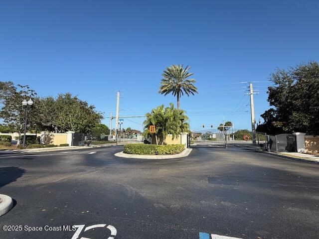 3868 Lexmark Lane, Unit 309 Rockledge, FL 32955 - Photo 27 of 39 a view of a street with a cars parked on road