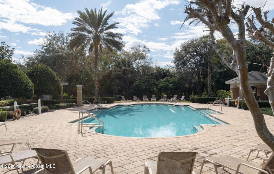3868 Lexmark Lane, Unit 309 Rockledge, FL 32955 - Photo 3 of 40 a view of swimming pool with chairs