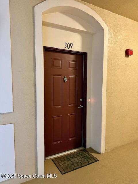 3868 Lexmark Lane, Unit 309 Rockledge, FL 32955 - Photo 35 of 39 a view of elevator with a wooden door