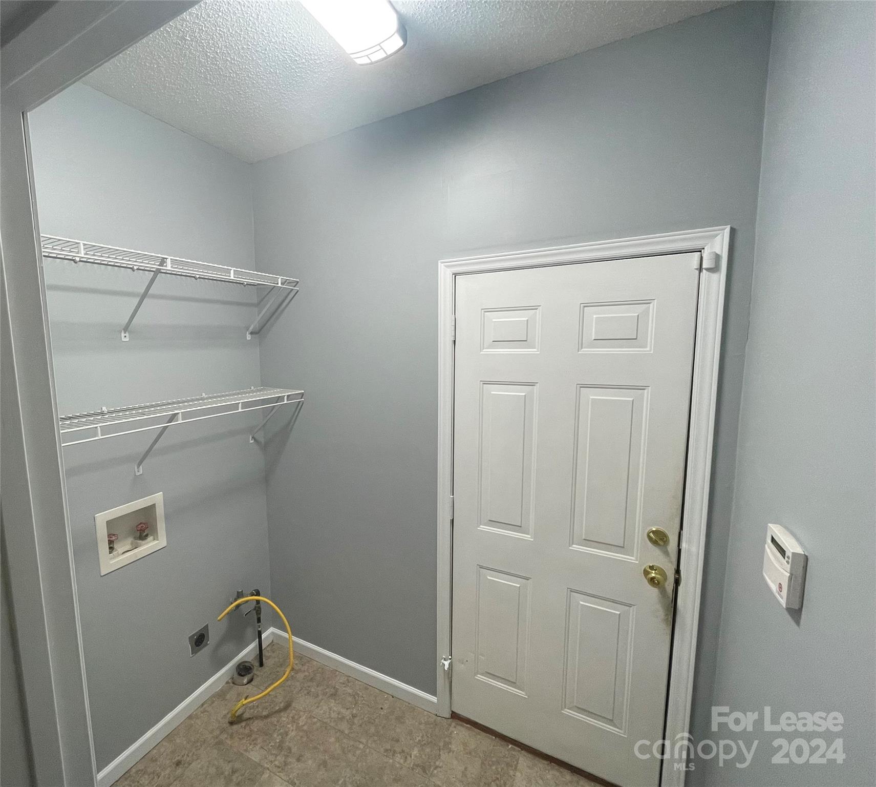 616 Rustling Winds Drive York, SC 29745 - Photo 13 of 16 a view of a room with rack on the wall