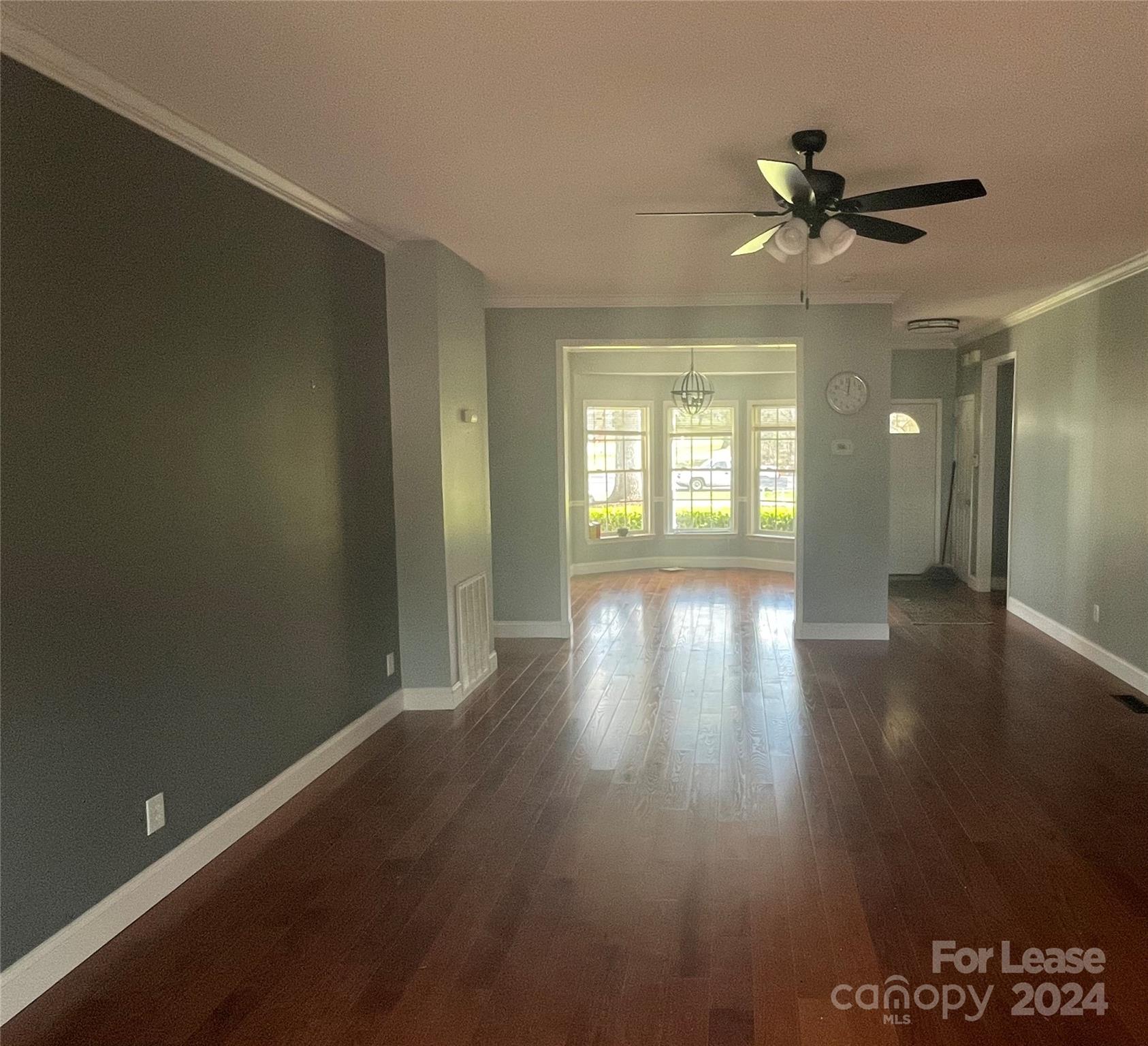 616 Rustling Winds Drive York, SC 29745 - Photo 6 of 16 an empty room with wooden floor and windows