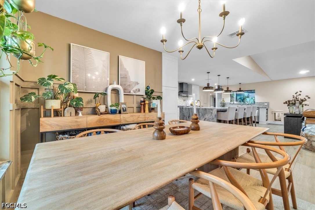 202 Ridgewood Avenue Clewiston, FL 33440 - Photo 12 of 50 a dining hall with dining table and chairs