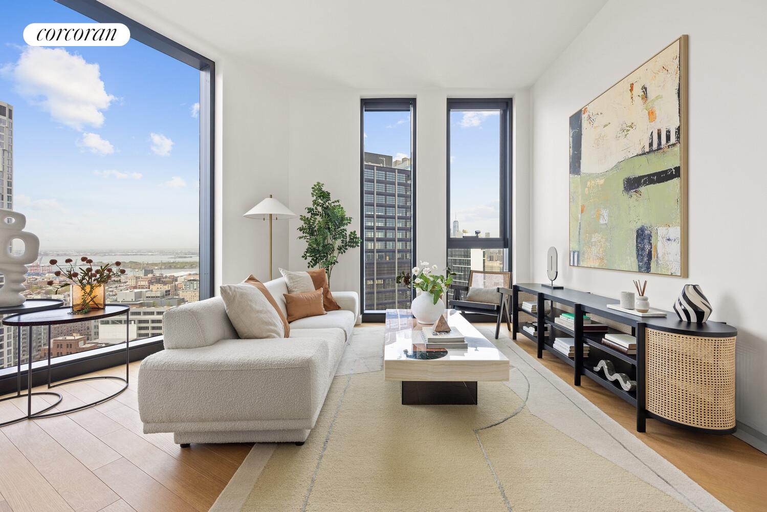 a living room with furniture and floor to ceiling window