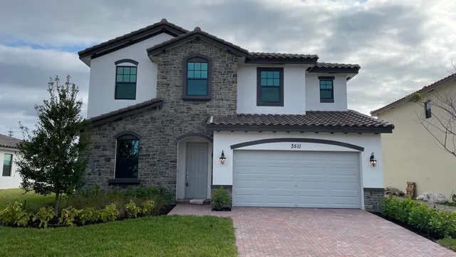 a front view of a house with a garage
