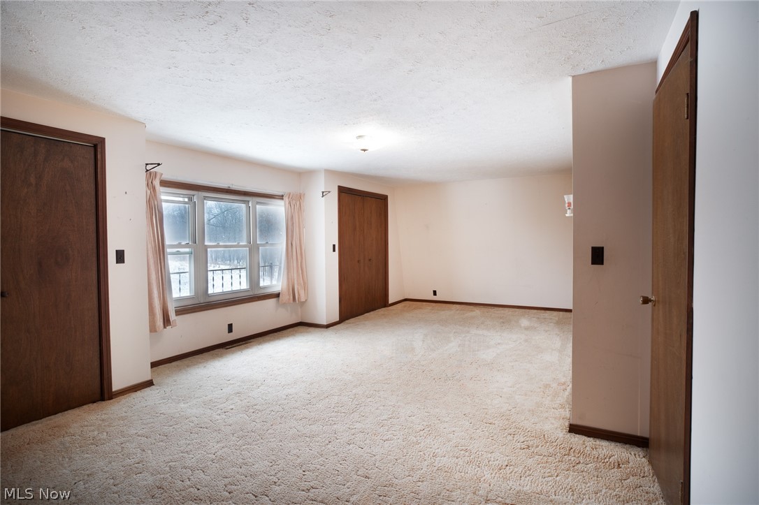 11 Pacific Road Northeast Carrollton, OH 44615 - Photo 27 of 46 Primary bedroom with 2 closets