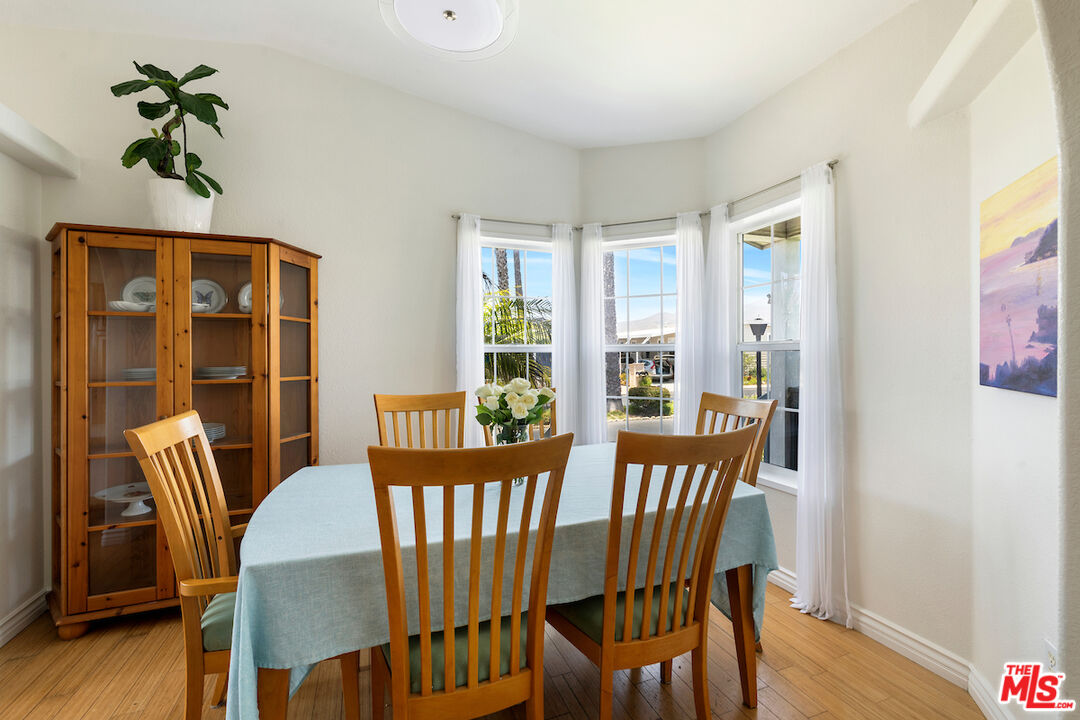 29500 Heathercliff Road, Unit 3 Malibu, CA 90265 - Photo 9 of 18 a view of a dining room with furniture window and wooden floor