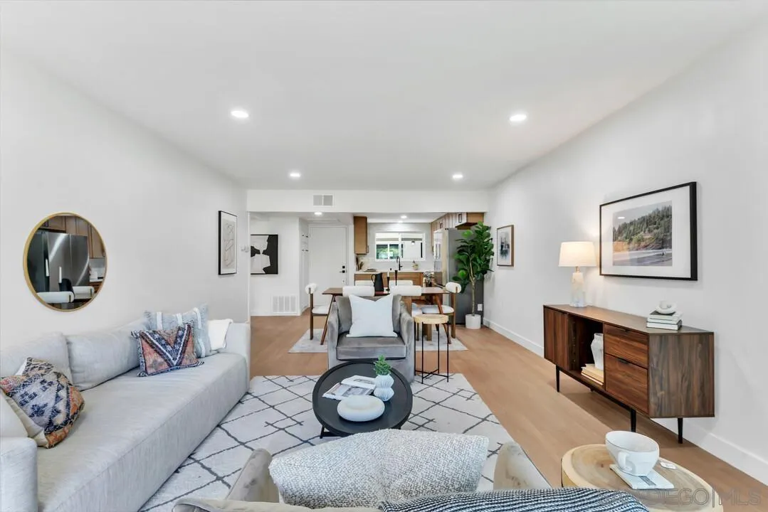 4095 Bonita Road, Unit 218 Bonita, CA 91902 - Photo 11 of 33 a living room with furniture a clock and a window