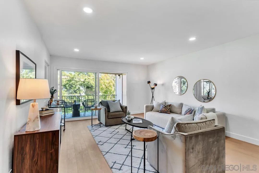 4095 Bonita Road, Unit 218 Bonita, CA 91902 - Photo 12 of 33 a living room with furniture a window and a lamp