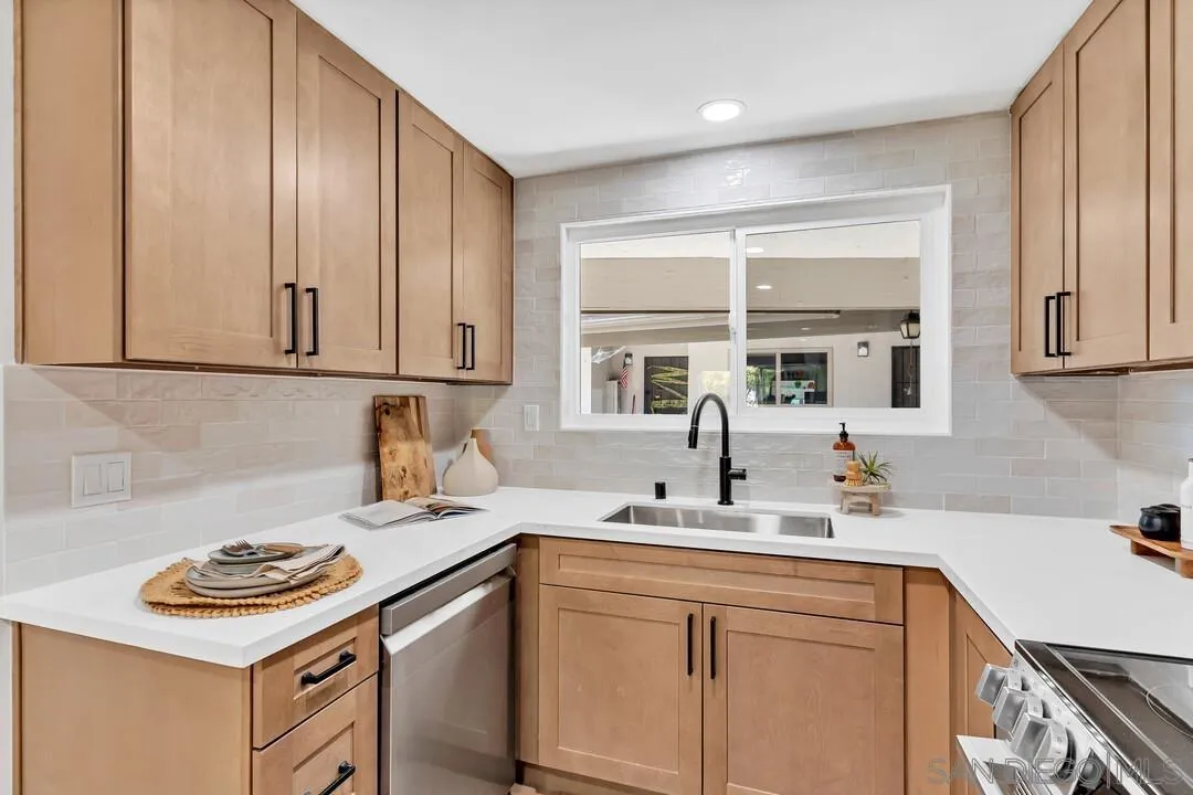 4095 Bonita Road, Unit 218 Bonita, CA 91902 - Photo 7 of 33 a kitchen with stainless steel appliances granite countertop a sink stove and cabinets