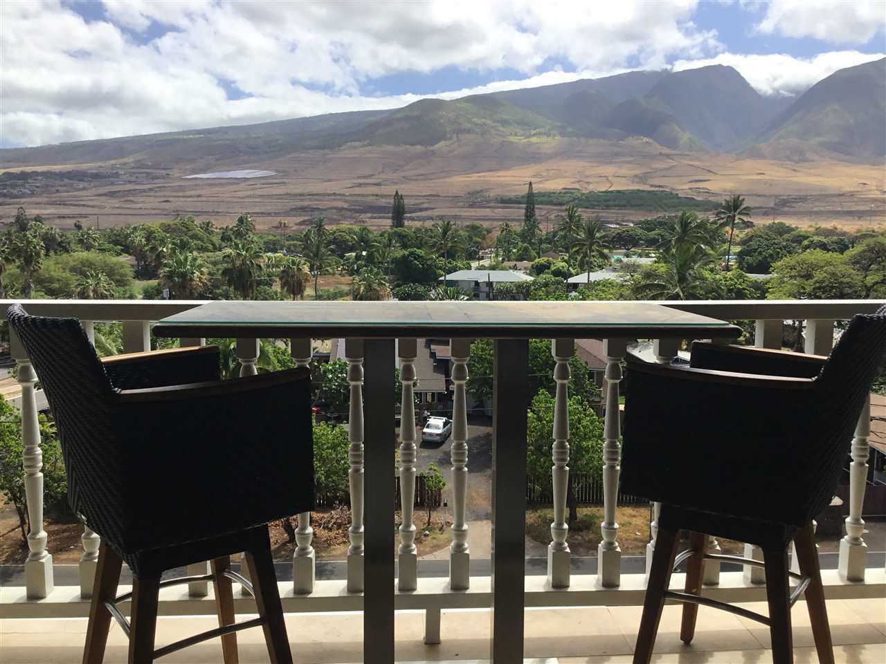 475 Front Street, Unit 624 Lahaina, HI 96761 - Photo 10 of 17 a view of a city from a balcony with chairs