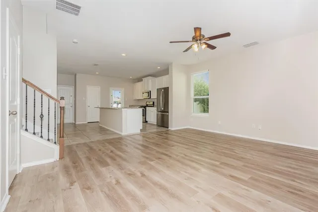 a view of a kitchen with a sink and a window