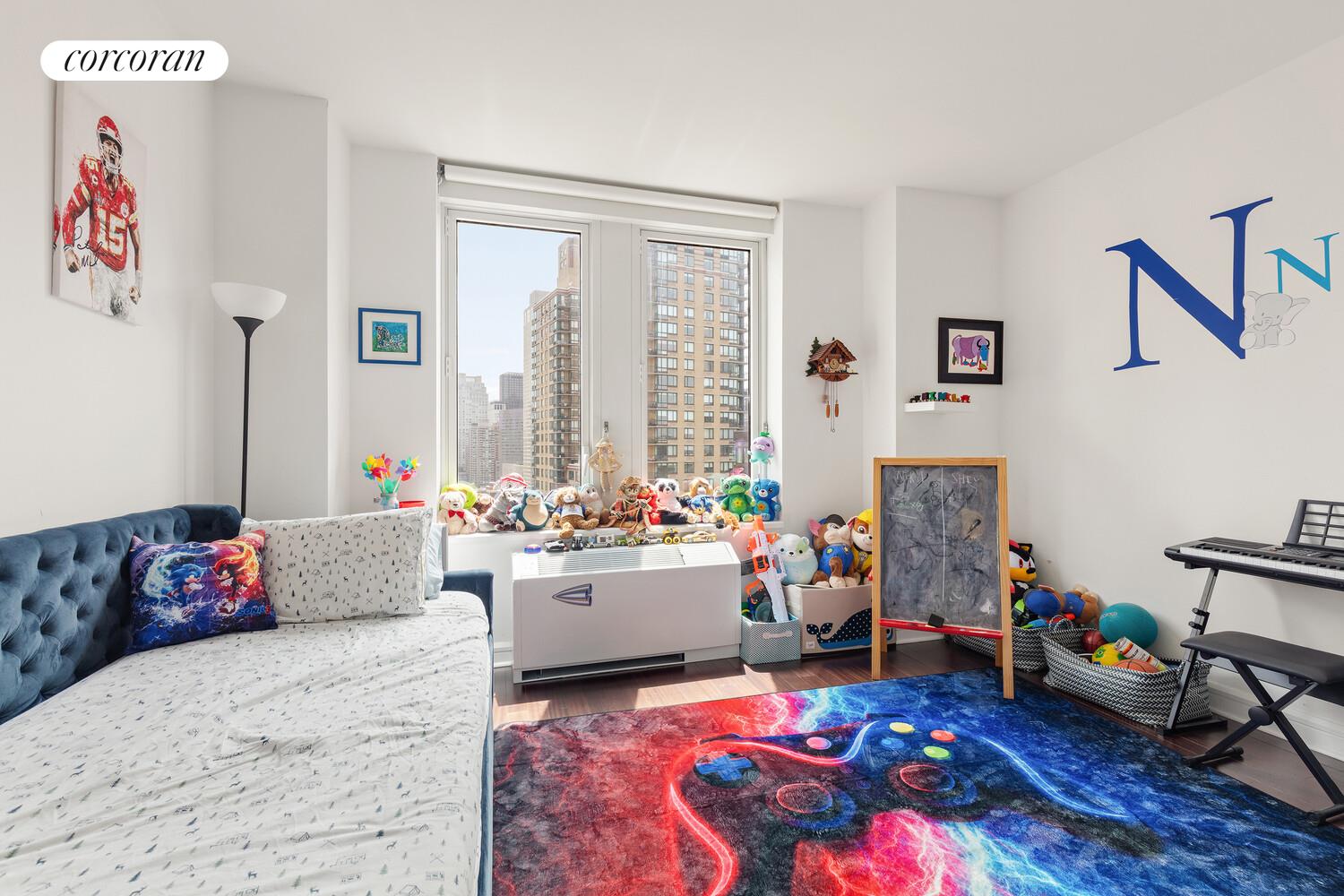 80 Riverside Boulevard, Unit 26C Manhattan, NY 10069 - Photo 5 of 6 a living room with furniture and a couch