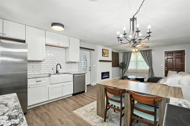 a very nice looking dining room with a table and chairs