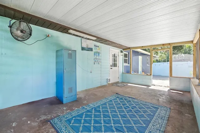 a view of empty room with windows