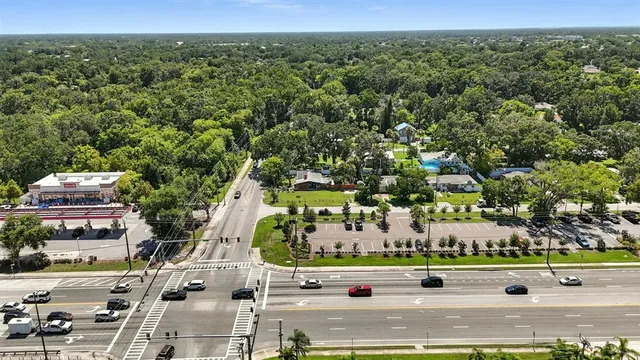 an aerial view of residential houses with outdoor space