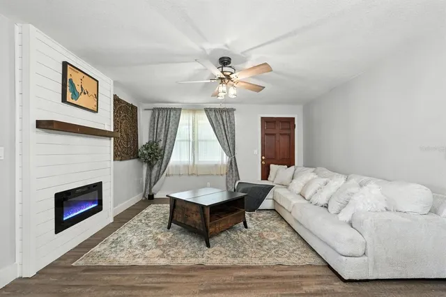 a living room with furniture and a fireplace
