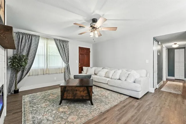 a living room with furniture and a large window