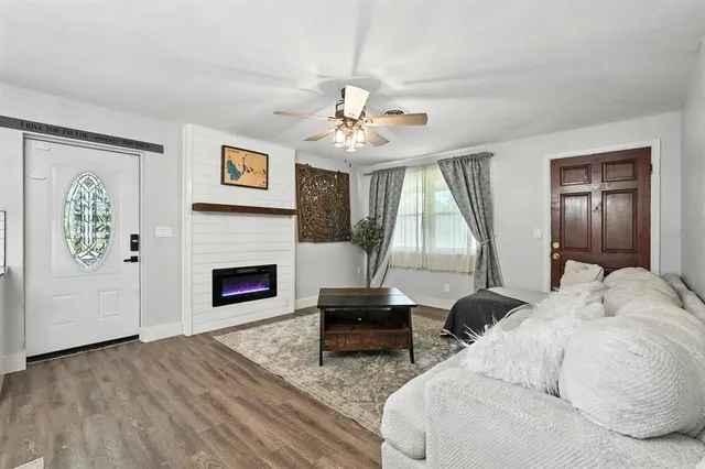 a living room with furniture and a fireplace