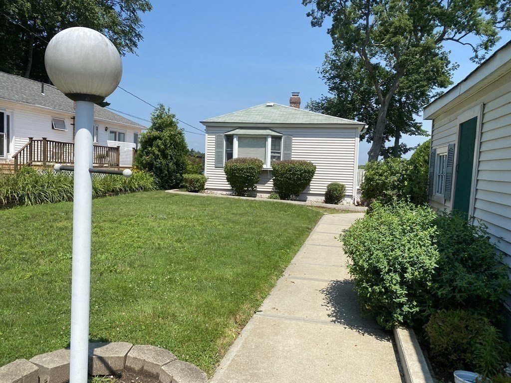300 Killdeer Road Webster, MA 01570 - Photo 22 of 42 a front view of a house with garden