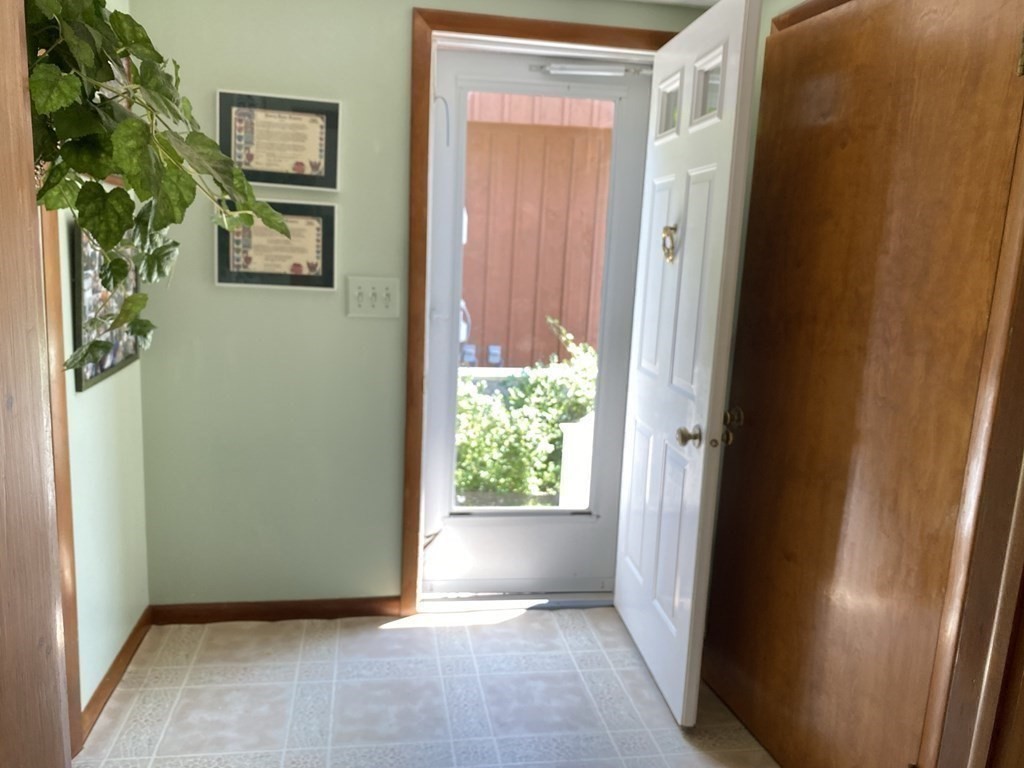 300 Killdeer Road Webster, MA 01570 - Photo 24 of 42 a view of an entryway with wooden floor and a door
