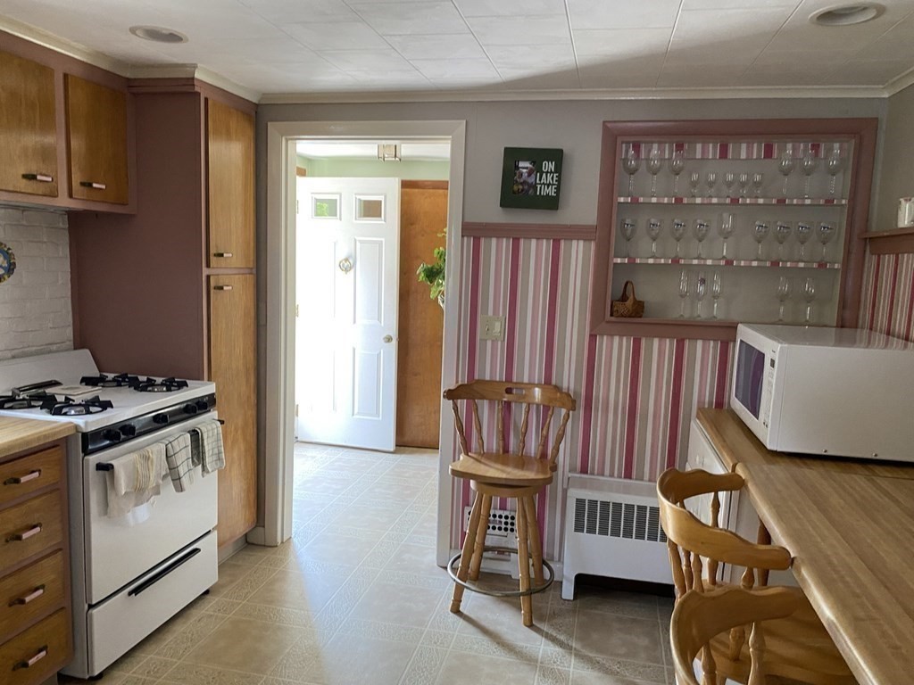 300 Killdeer Road Webster, MA 01570 - Photo 26 of 42 a view of a hallway with entryway wooden floor windows and a livingroom