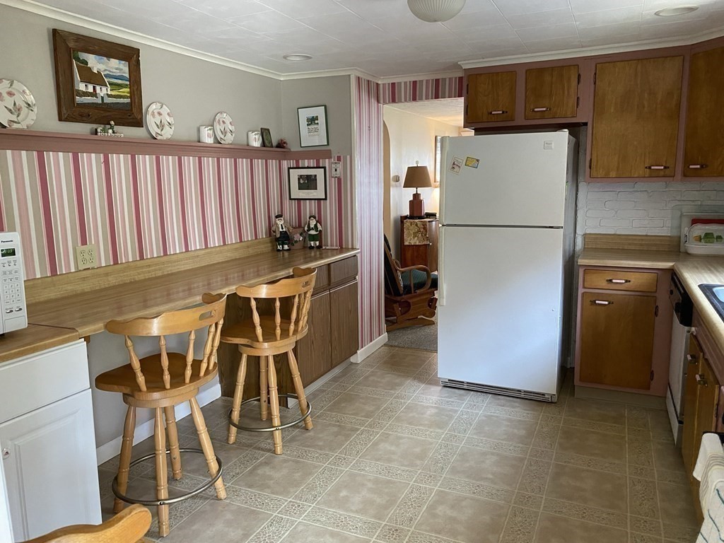 300 Killdeer Road Webster, MA 01570 - Photo 28 of 42 a kitchen with stainless steel appliances a refrigerator a stove a sink and a refrigerator
