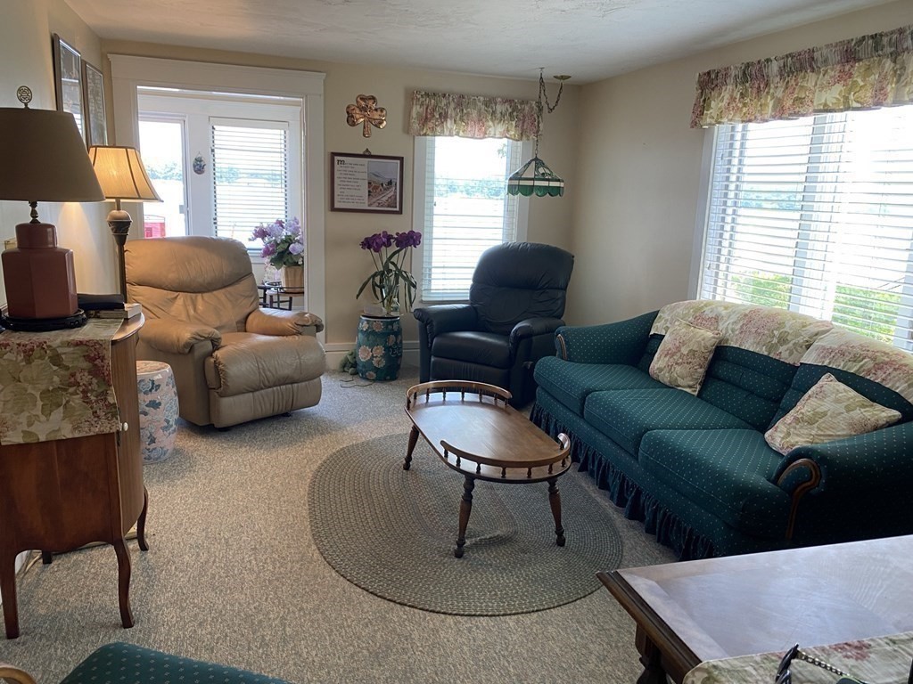 300 Killdeer Road Webster, MA 01570 - Photo 29 of 42 a living room with furniture and a large window