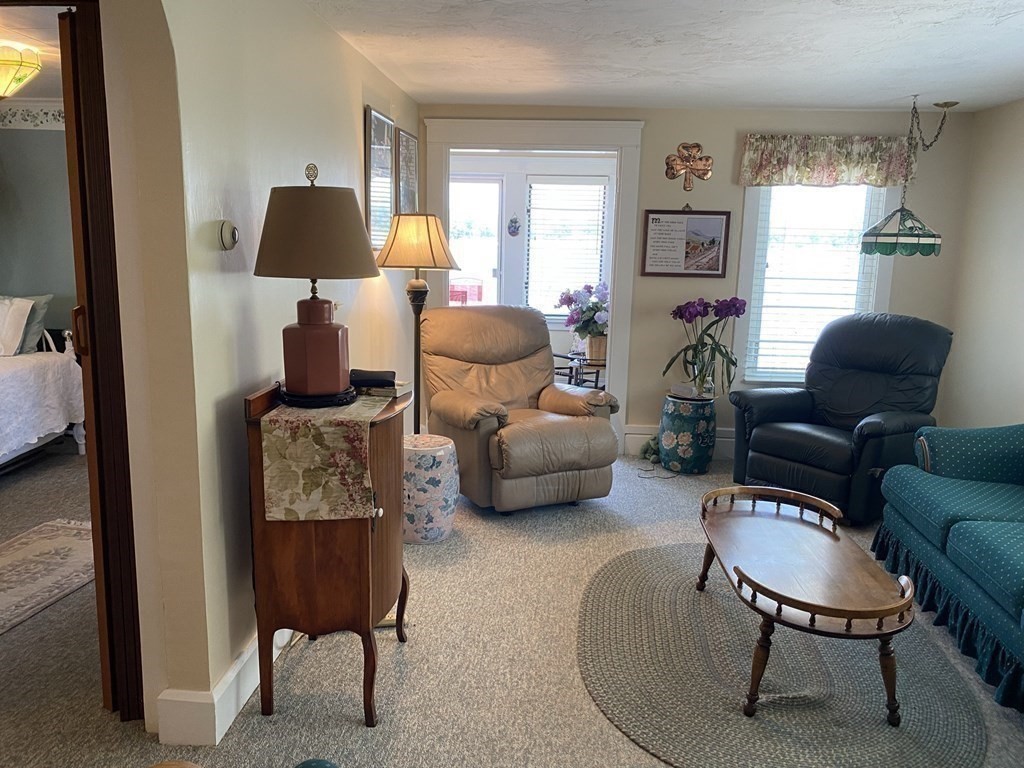300 Killdeer Road Webster, MA 01570 - Photo 30 of 42 a living room with furniture and a window