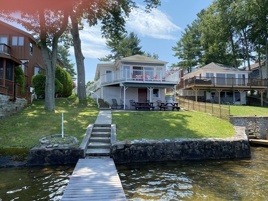 300 Killdeer Road Webster, MA 01570 - Photo 3 of 42 a front view of a house with garden