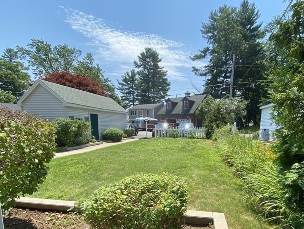 300 Killdeer Road Webster, MA 01570 - Photo 39 of 42 a front view of a house with garden