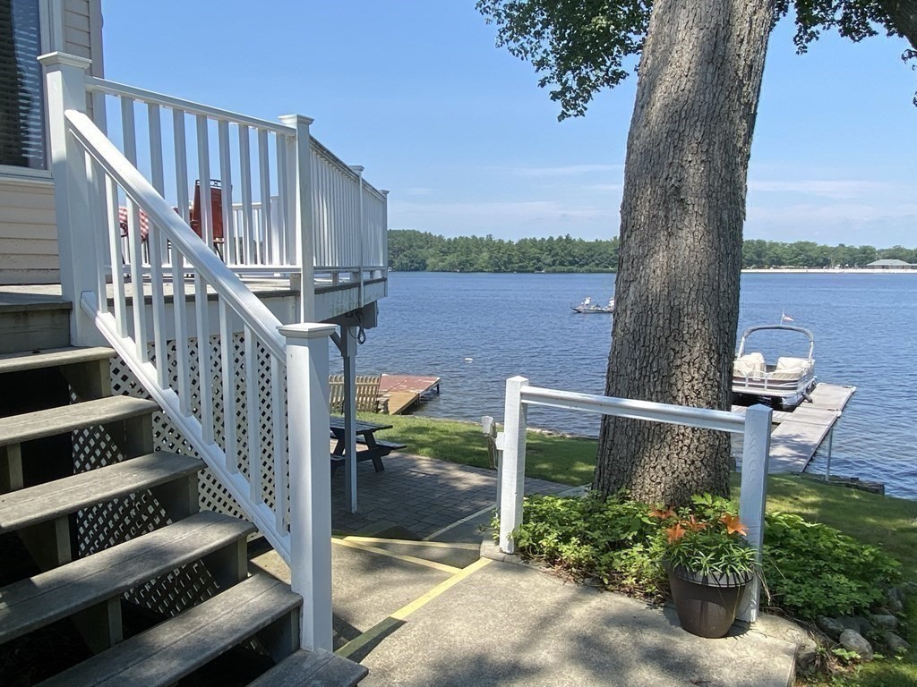 300 Killdeer Road Webster, MA 01570 - Photo 7 of 42 a view of balcony with wooden floor and outdoor seating