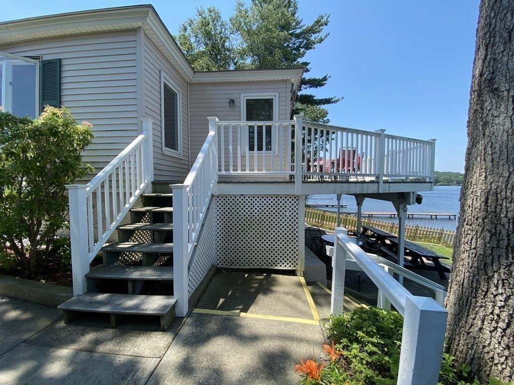 300 Killdeer Road Webster, MA 01570 - Photo 8 of 42 a front view of a house with a yard