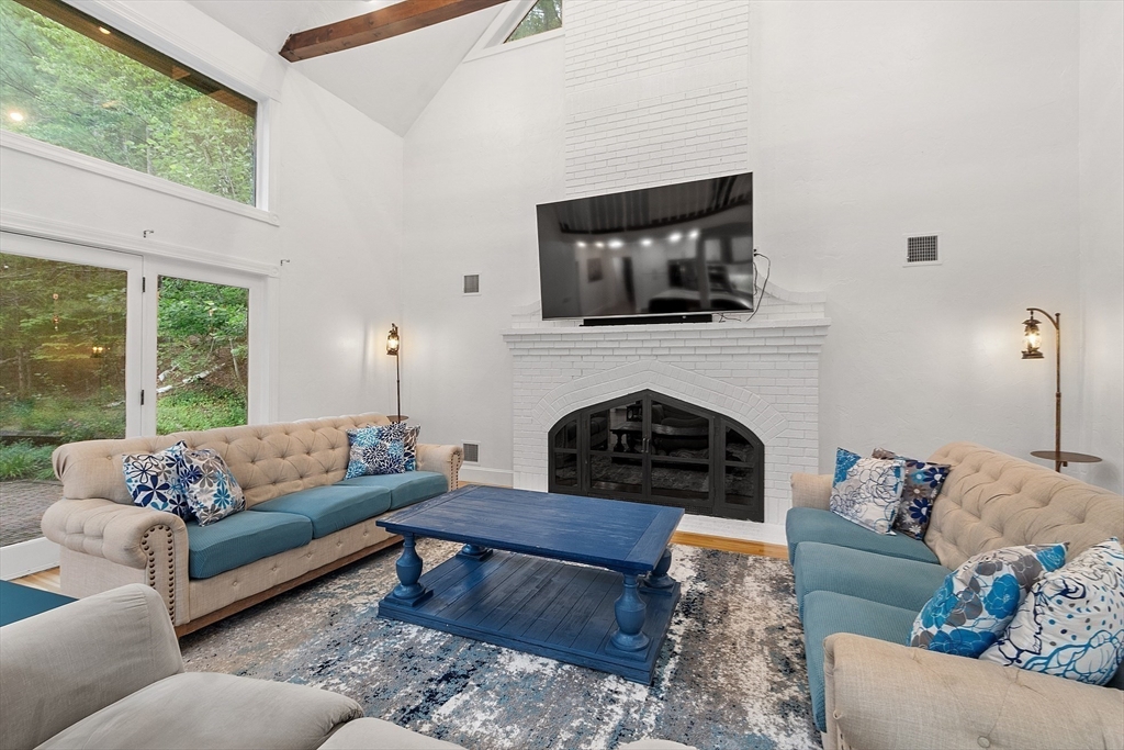 34 Wildmeadow Road Boxford, MA 01921 - Photo 13 of 40 a living room with furniture and a fireplace
