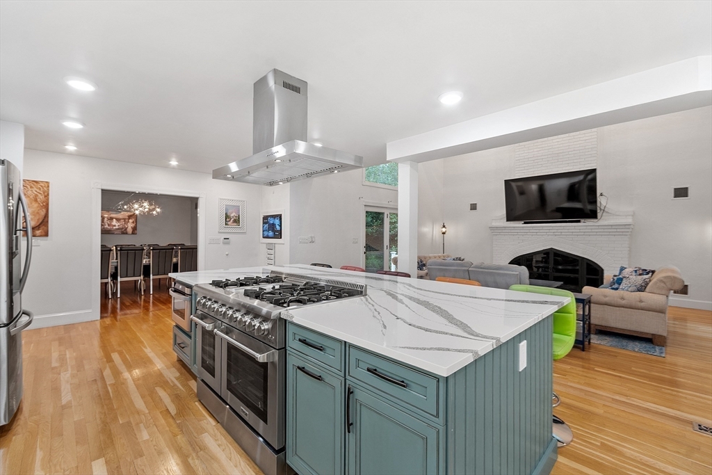 34 Wildmeadow Road Boxford, MA 01921 - Photo 15 of 40 a kitchen with a stove and a wooden floor