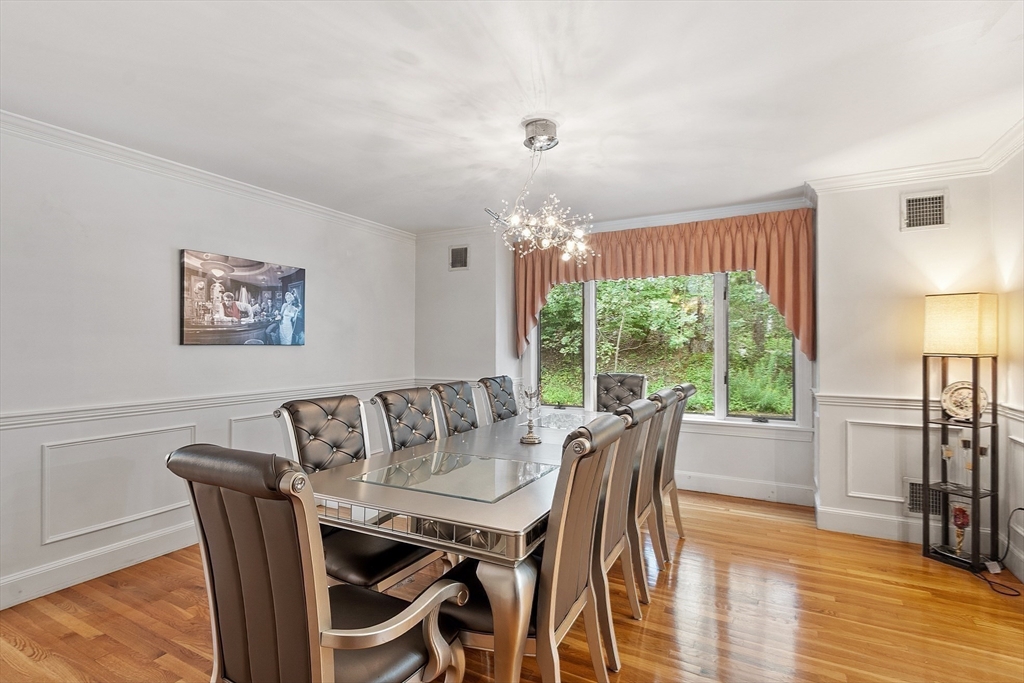 34 Wildmeadow Road Boxford, MA 01921 - Photo 17 of 40 a view of a dining room with furniture window and wooden floor