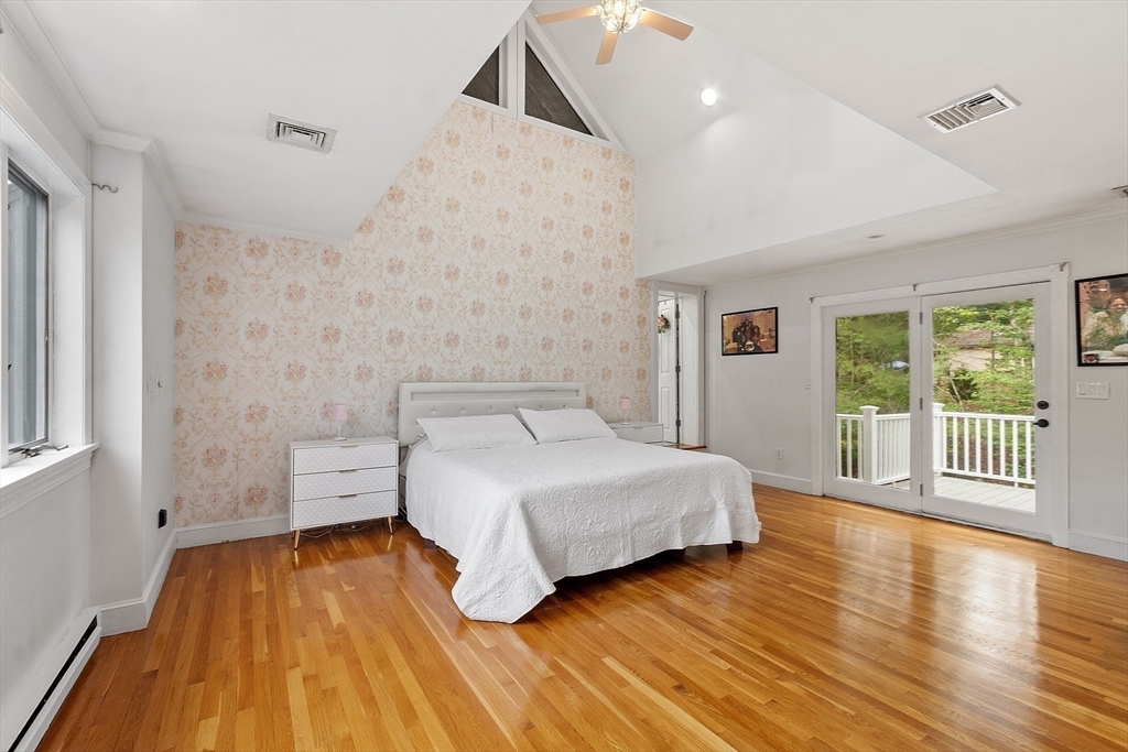 34 Wildmeadow Road Boxford, MA 01921 - Photo 26 of 40 a spacious bedroom with a bed and wooden floor
