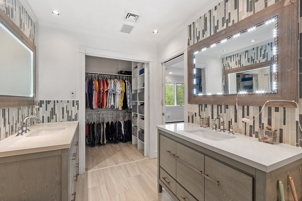 34 Wildmeadow Road Boxford, MA 01921 - Photo 27 of 40 a spacious bathroom with a double vanity sink a mirror and a bathtub