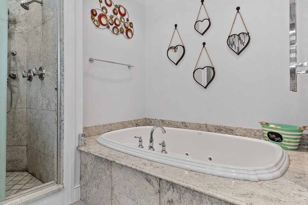 34 Wildmeadow Road Boxford, MA 01921 - Photo 28 of 40 a bathroom with a bathtub and shower