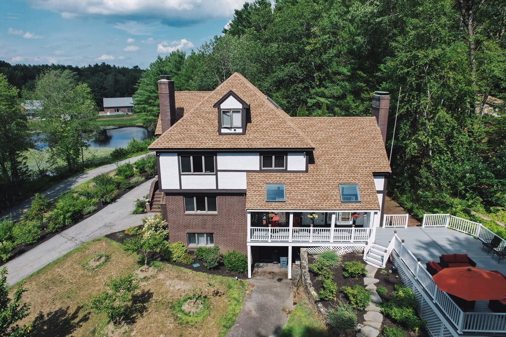 34 Wildmeadow Road Boxford, MA 01921 - Photo 3 of 40 an aerial view of a house with a yard and potted plants