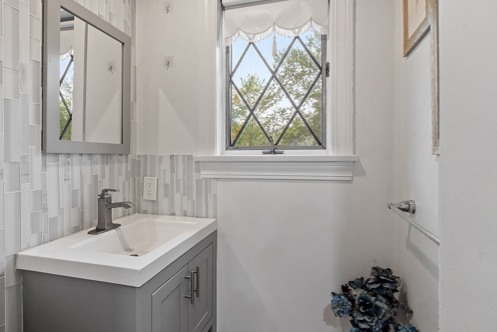 34 Wildmeadow Road Boxford, MA 01921 - Photo 33 of 40 a bathroom with a sink a vanity and a window