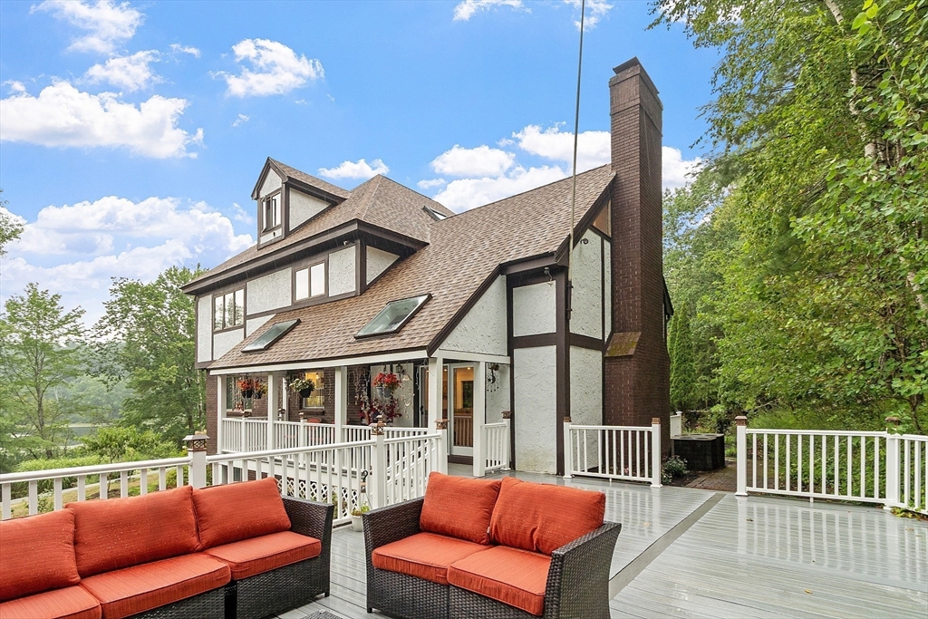 34 Wildmeadow Road Boxford, MA 01921 - Photo 38 of 40 a view of a patio with couches chairs and wooden floor