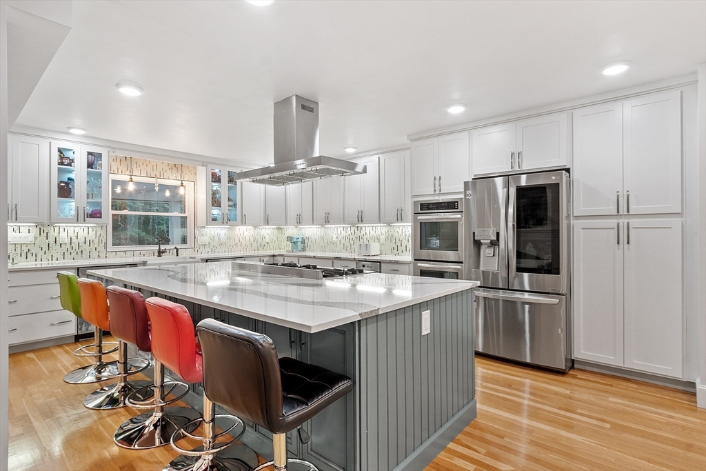 34 Wildmeadow Road Boxford, MA 01921 - Photo 9 of 40 a kitchen with stainless steel appliances granite countertop a sink and a refrigerator