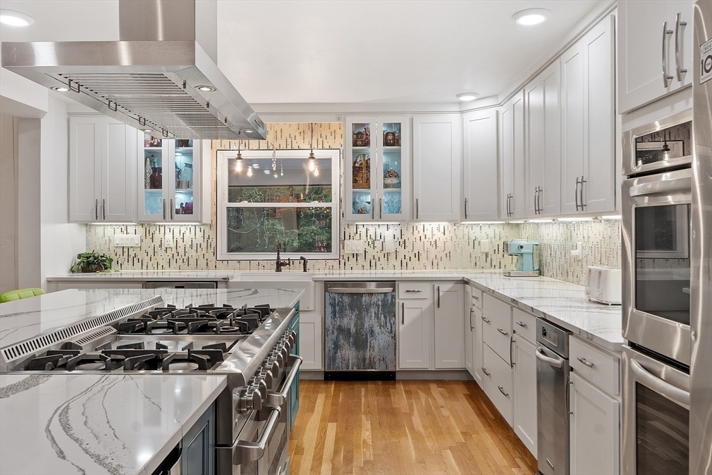 34 Wildmeadow Road Boxford, MA 01921 - Photo 10 of 40 a kitchen with a stove a sink and a refrigerator