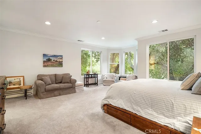a view of a livingroom with workspace and a window